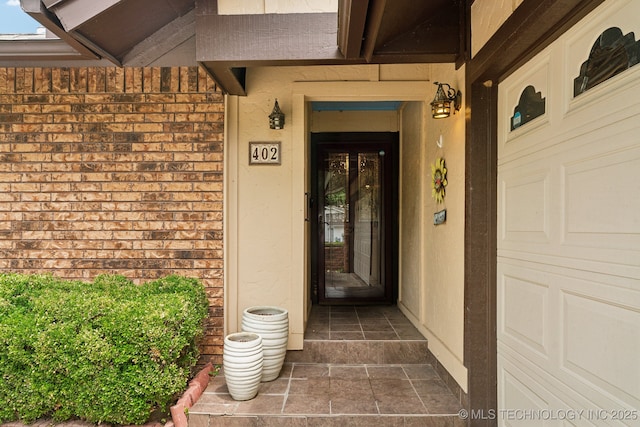 entrance to property with brick siding