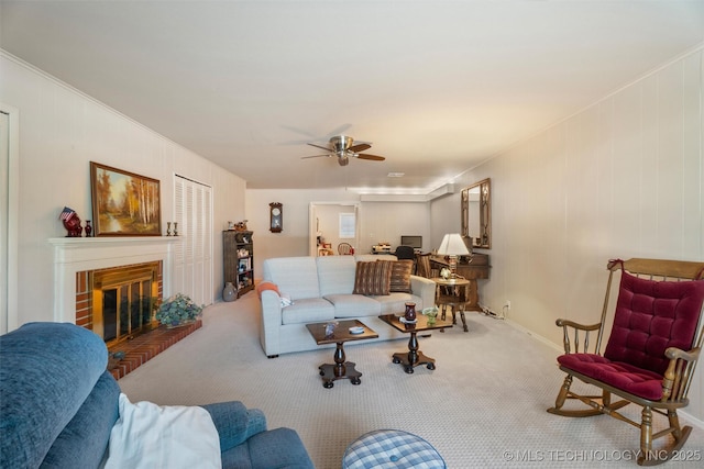 107 W 12th St Unit 107, Bartlesville, OK 74003 - carpeted living room with ceiling fan and a brick fireplace