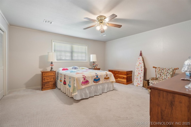 107 W 12th St Unit 107, Bartlesville, OK 74003 - bedroom with a closet, carpet flooring, crown molding, a ceiling fan, and baseboards