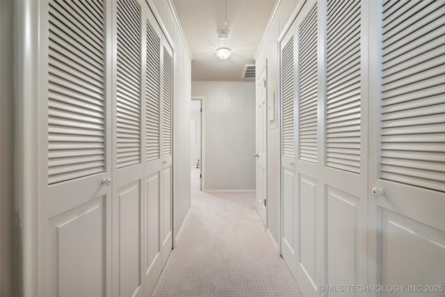 107 W 12th St Unit 107, Bartlesville, OK 74003 - hall with light carpet and baseboards