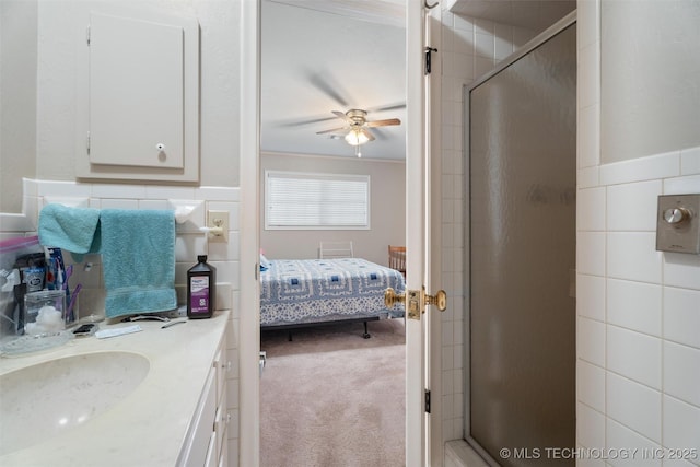 107 W 12th St Unit 107, Bartlesville, OK 74003 - full bathroom featuring a ceiling fan, ensuite bath, a stall shower, vanity, and crown molding