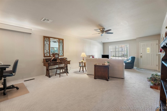 107 W 12th St Unit 107, Bartlesville, OK 74003 - living area featuring an office area, a ceiling fan, light carpet, and baseboards