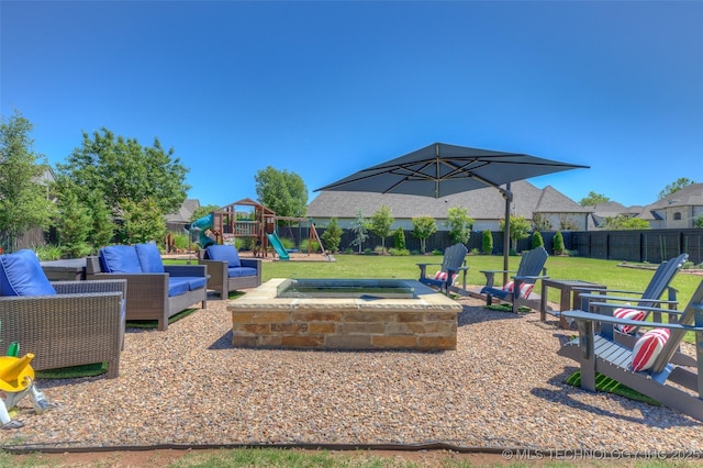 6623 E 134th Pl S, Bixby, OK 74008 - view of patio / terrace with a playground, outdoor lounge area, and an in-ground hot tub