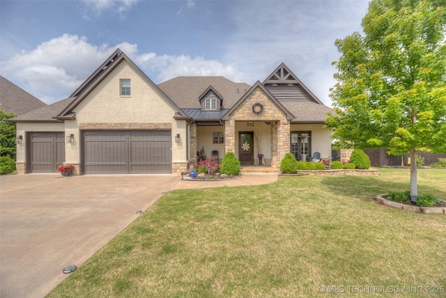 6623 E 134th Pl S, Bixby, OK 74008 - view of front facade featuring stone siding, a standing seam roof, driveway, and a garage