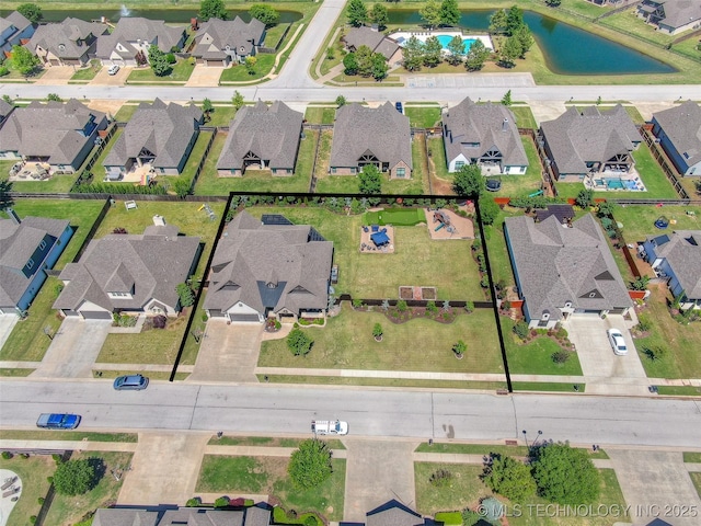 6623 E 134th Pl S, Bixby, OK 74008 - aerial perspective of suburban area featuring property parcel outlined and a large body of water