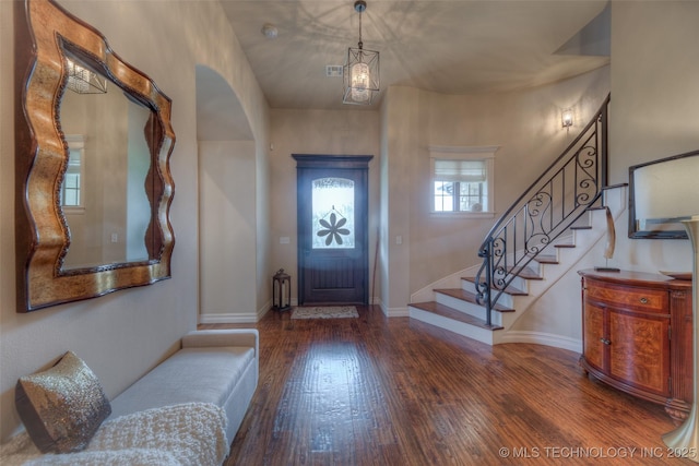 6623 E 134th Pl S, Bixby, OK 74008 - entrance foyer with wood finished floors, stairs, baseboards, and arched walkways