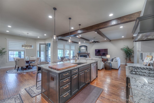 6623 E 134th Pl S, Bixby, OK 74008 - kitchen featuring appliances with stainless steel finishes, baseboards, a sink, a breakfast bar, and recessed lighting