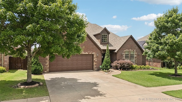 14538 S Urbana Ct, Bixby, OK 74008 - view of front of property with brick siding, a garage, concrete driveway, and a shingled roof