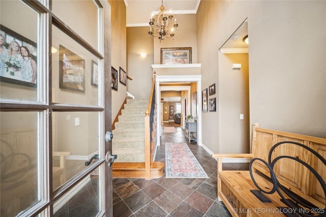 14538 S Urbana Ct, Bixby, OK 74008 - entrance foyer with crown molding, dark stone finish floors, a chandelier, baseboards, and stairway
