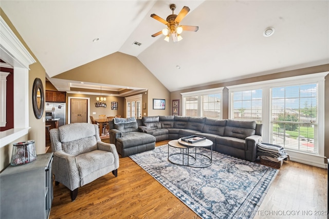 14538 S Urbana Ct, Bixby, OK 74008 - living area featuring healthy amount of natural light, light wood-style flooring, a ceiling fan, and high vaulted ceiling