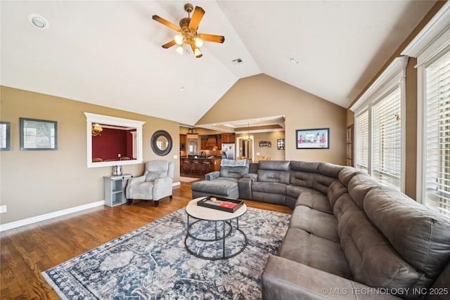 14538 S Urbana Ct, Bixby, OK 74008 - living area with ceiling fan, wood finished floors, baseboards, and high vaulted ceiling