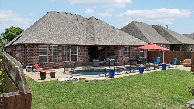 14538 S Urbana Ct, Bixby, OK 74008 - rear view of house featuring a patio area, brick siding, and a shingled roof