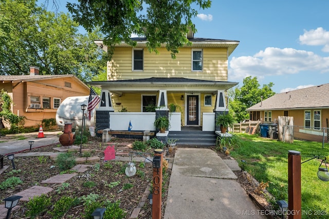 408 S Phoenix Ave, Tulsa, OK 74127 - american foursquare style home featuring a porch and a front yard