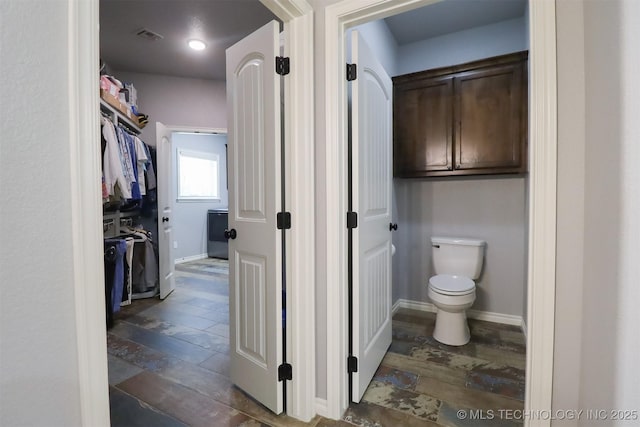 17061 S Creekwood Trl, Claremore, OK 74017 - bathroom featuring toilet and baseboards