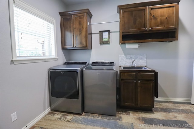 17061 S Creekwood Trl, Claremore, OK 74017 - washroom featuring cabinet space, washer and clothes dryer, baseboards, and wood finished floors