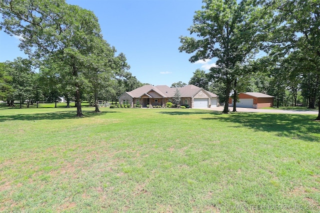 17061 S Creekwood Trl, Claremore, OK 74017 - view of green lawn with a garage