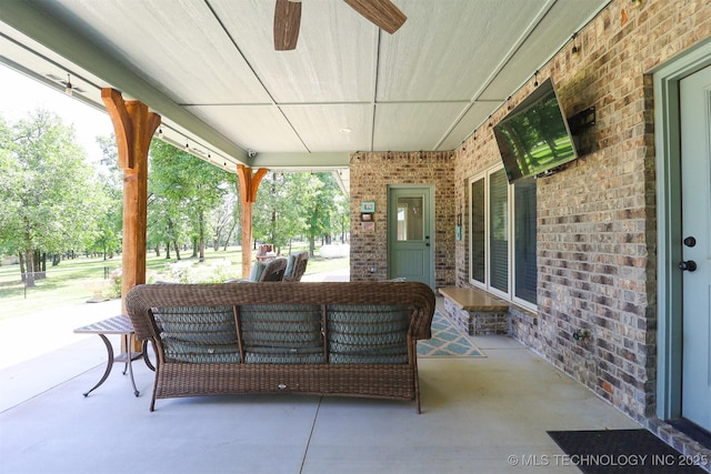 17061 S Creekwood Trl, Claremore, OK 74017 - covered porch featuring an outdoor hangout area and a ceiling fan