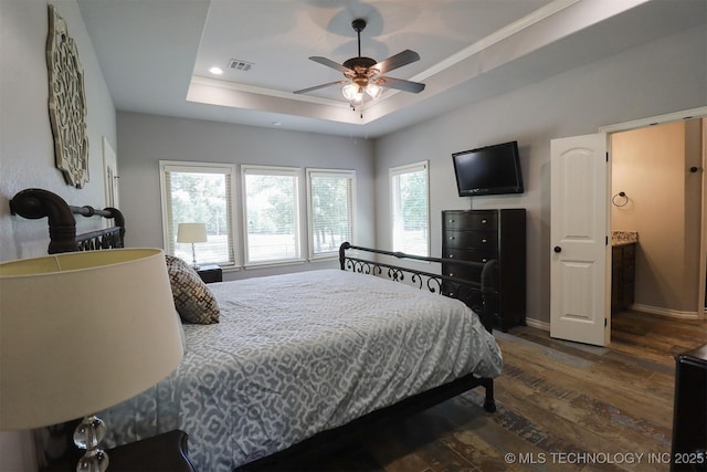 17061 S Creekwood Trl, Claremore, OK 74017 - bedroom with dark wood finished floors, a tray ceiling, ornamental molding, recessed lighting, and baseboards
