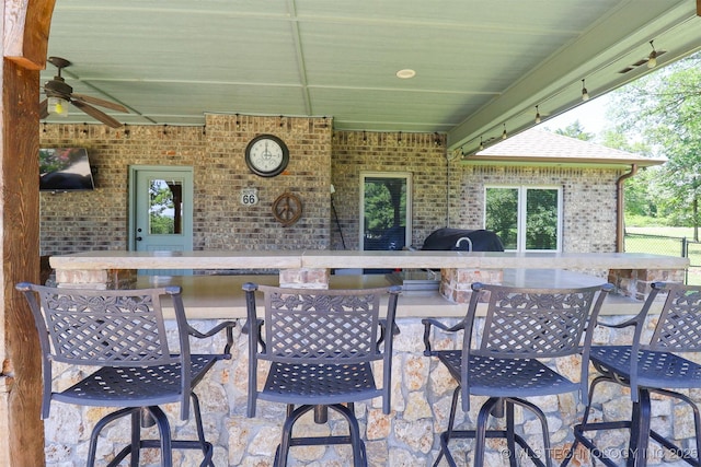 17061 S Creekwood Trl, Claremore, OK 74017 - view of patio with an outdoor bar, a ceiling fan, and area for grilling