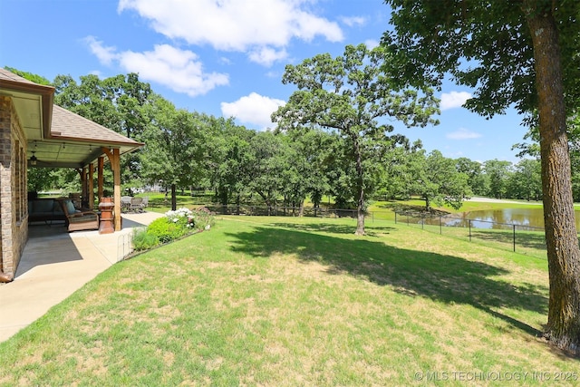 17061 S Creekwood Trl, Claremore, OK 74017 - view of yard with a water view, a patio, and view of scattered trees