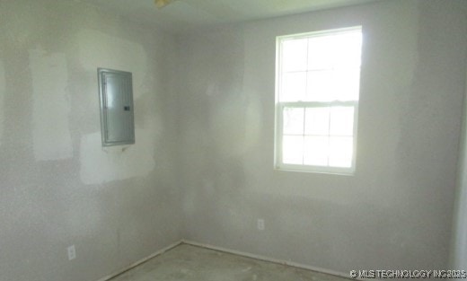 13290 S 4230th Rd, Claremore, OK 74017 - spare room featuring electric panel and plenty of natural light