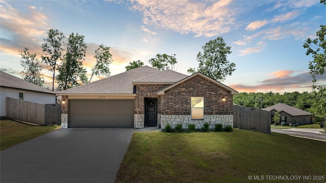 3324 N 23rd W Ave, Tulsa, OK 74127 - view of front of property featuring brick siding, a garage, a shingled roof, and driveway