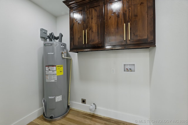 1245 N Yale Ave, Tulsa, OK 74115 - laundry room with hookup for an electric dryer, water heater, cabinet space, hookup for a washing machine, and baseboards