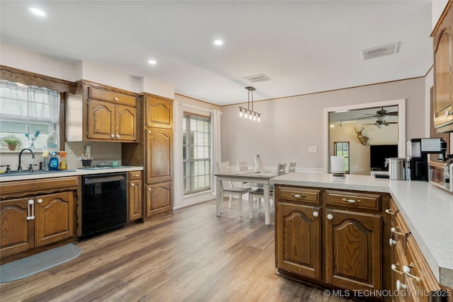 616 S Schlegel, Cushing, OK 74023 - kitchen with black dishwasher, a sink, light countertops, a ceiling fan, and recessed lighting