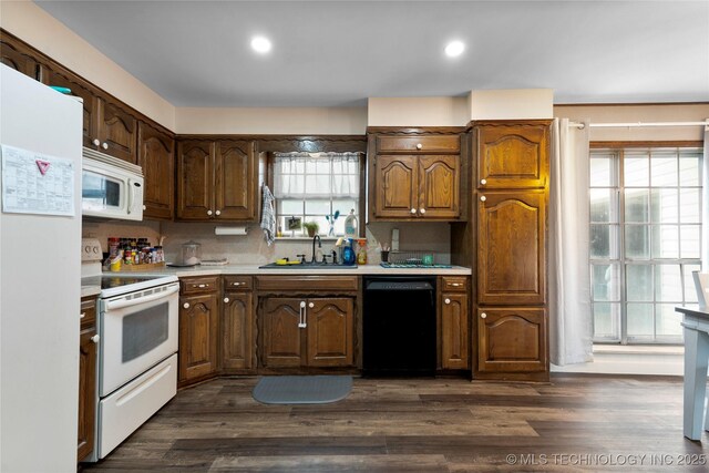 616 S Schlegel, Cushing, OK 74023 - kitchen featuring white appliances, a sink, light countertops, dark wood finished floors, and recessed lighting