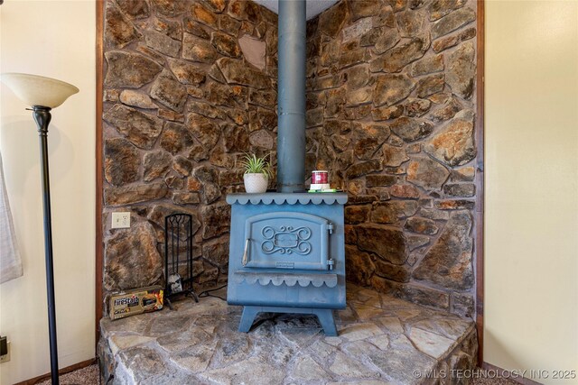 616 S Schlegel, Cushing, OK 74023 - detailed view of a wood stove and baseboards