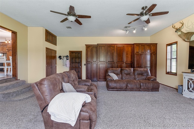 616 S Schlegel, Cushing, OK 74023 - living area featuring a ceiling fan, carpet flooring, and a textured ceiling