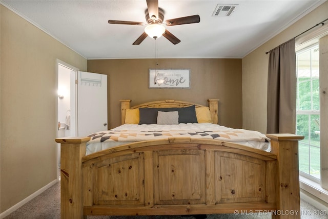 616 S Schlegel, Cushing, OK 74023 - bedroom featuring crown molding, carpet, multiple windows, baseboards, and ceiling fan
