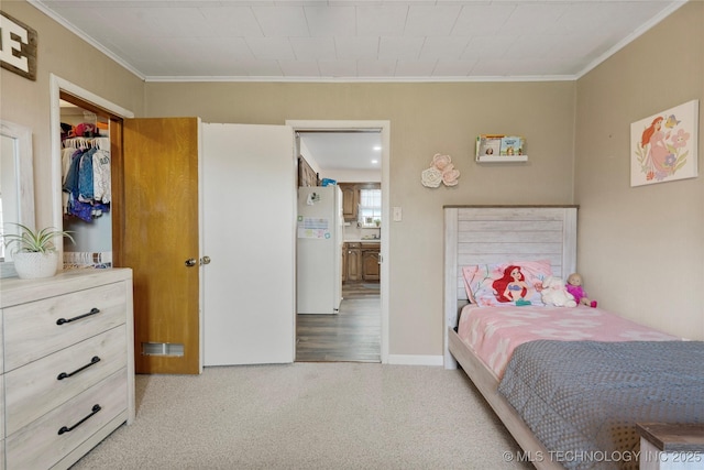 616 S Schlegel, Cushing, OK 74023 - carpeted bedroom featuring crown molding and freestanding refrigerator
