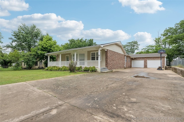 307 S Cherokee, Locust Grove, OK 74352 - ranch-style house with a porch, concrete driveway, brick siding, and an attached garage
