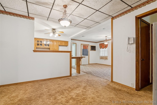307 S Cherokee, Locust Grove, OK 74352 - unfurnished room featuring light colored carpet, ceiling fan, baseboards, and a drop ceiling