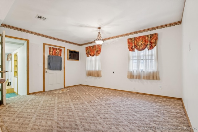307 S Cherokee, Locust Grove, OK 74352 - empty room featuring carpet flooring, crown molding, baseboards, and a wall mounted air conditioner