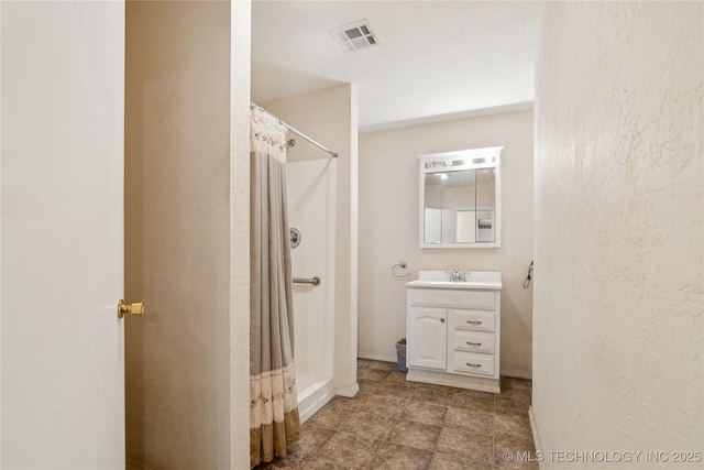 307 S Cherokee, Locust Grove, OK 74352 - bathroom featuring vanity, a shower with curtain, and a textured wall