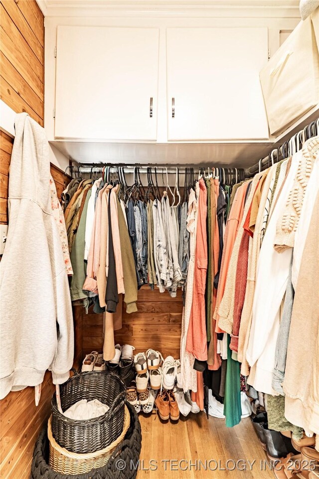 109 E 14th St, Pawhuska, OK 74056 - walk in closet featuring wood finished floors