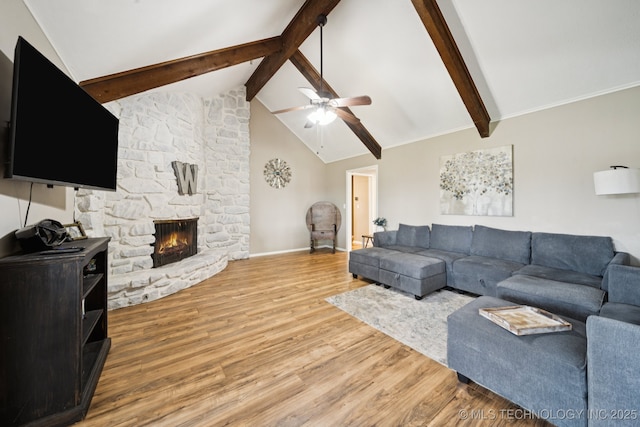 12350 E 138th St S, Broken Arrow, OK 74011 - living area featuring beamed ceiling, light wood finished floors, a ceiling fan, a stone fireplace, and baseboards