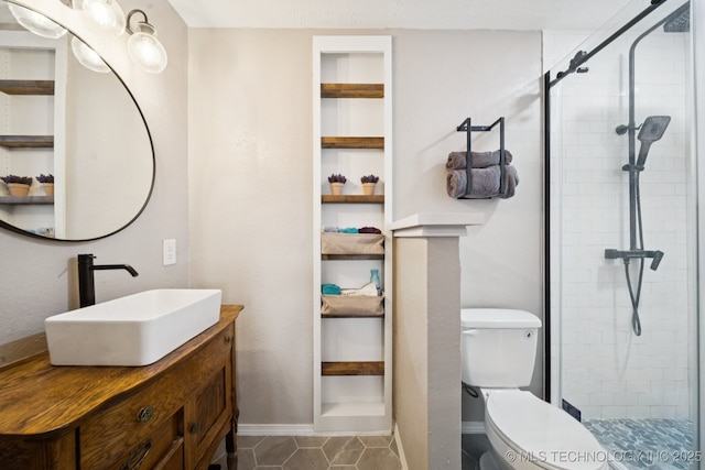 12350 E 138th St S, Broken Arrow, OK 74011 - bathroom with toilet, vanity, a stall shower, baseboards, and tile patterned floors
