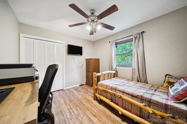 12350 E 138th St S, Broken Arrow, OK 74011 - bedroom with light wood-style flooring, a closet, ceiling fan, and baseboards