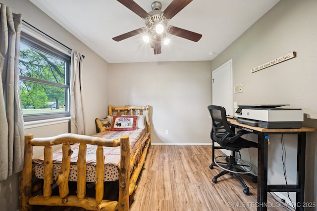 12350 E 138th St S, Broken Arrow, OK 74011 - bedroom with light wood finished floors, baseboards, a desk, and ceiling fan