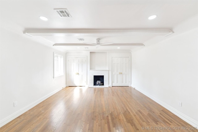 302 E 29th St, Tulsa, OK 74114 - unfurnished living room with baseboards, a fireplace with raised hearth, light wood finished floors, ceiling fan, and recessed lighting