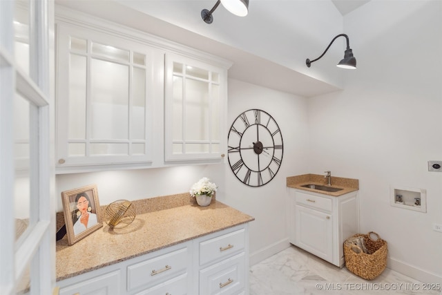 302 E 29th St, Tulsa, OK 74114 - laundry room with a sink, hookup for an electric dryer, washer hookup, light marble finish floors, and baseboards
