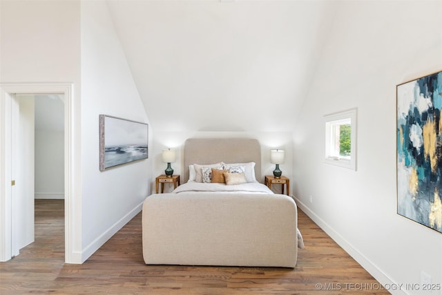 302 E 29th St, Tulsa, OK 74114 - bedroom featuring vaulted ceiling, wood finished floors, and baseboards
