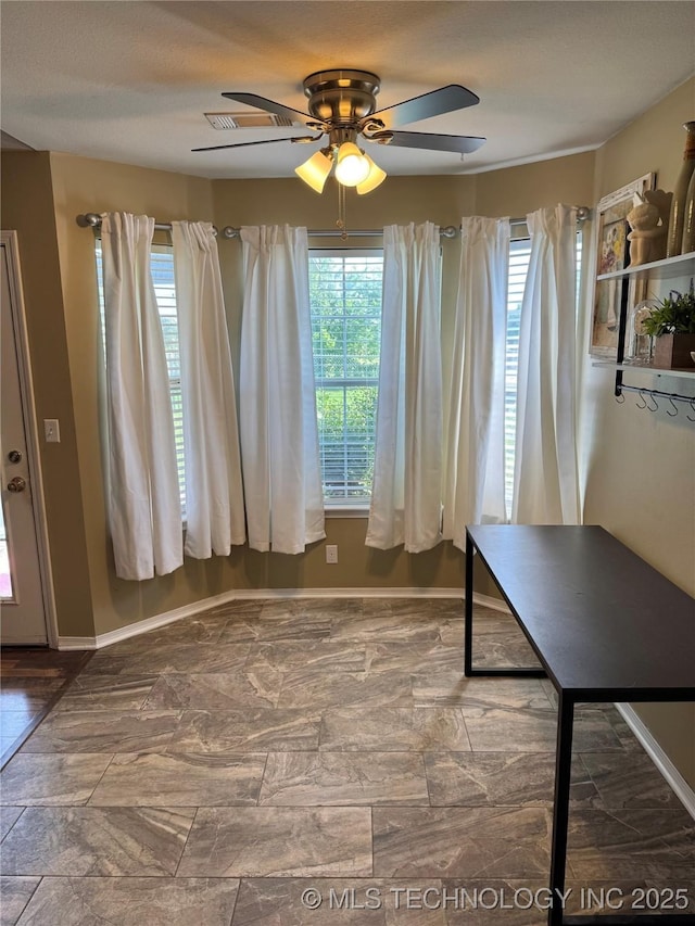 509 W Ryan St, Catoosa, OK 74015 - dining space featuring baseboards, ceiling fan, and healthy amount of natural light