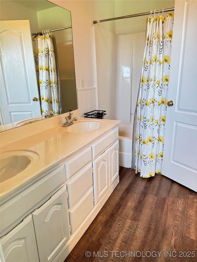 509 W Ryan St, Catoosa, OK 74015 - bathroom featuring double vanity, wood finished floors, and shower / bathtub combination with curtain