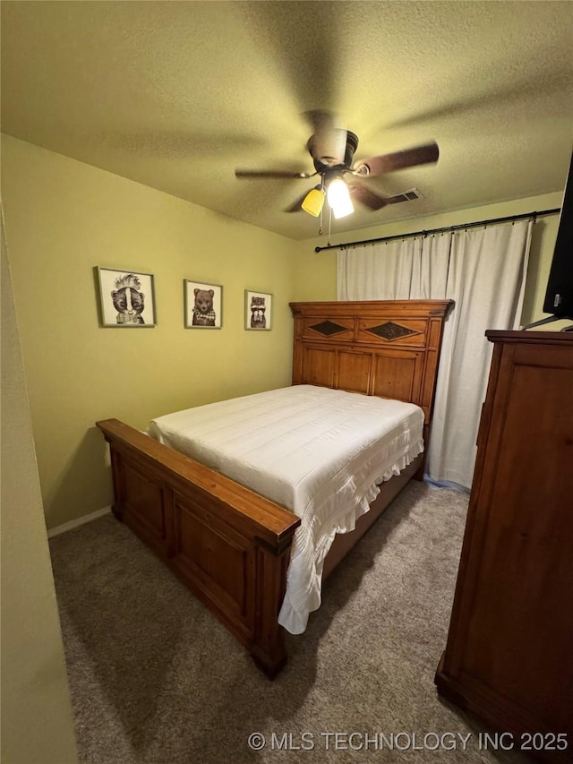509 W Ryan St, Catoosa, OK 74015 - carpeted bedroom featuring a textured ceiling and ceiling fan