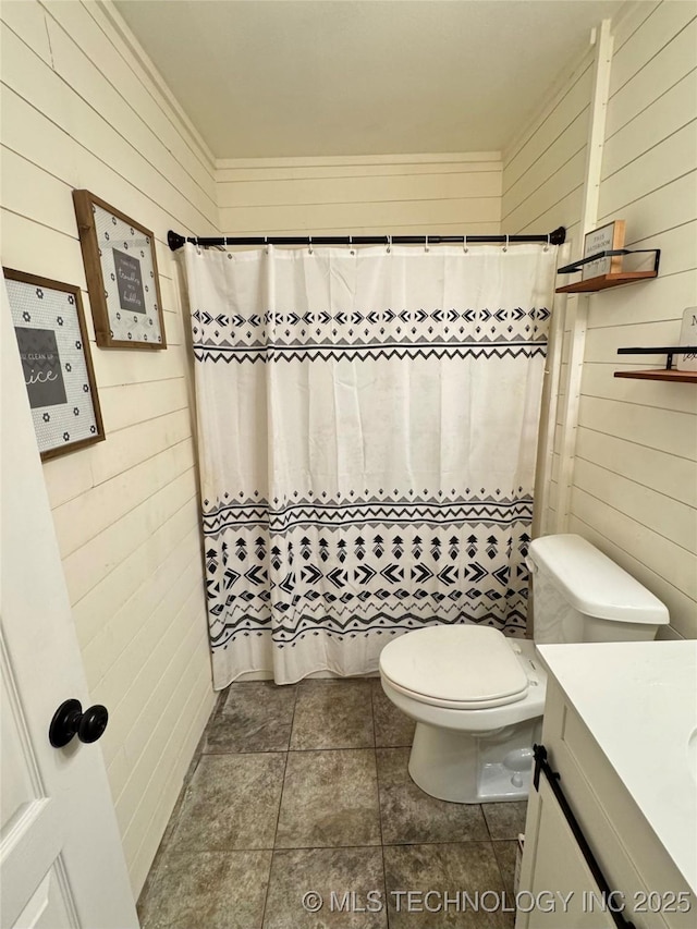509 W Ryan St, Catoosa, OK 74015 - bathroom with wooden walls, vanity, toilet, and a shower with curtain