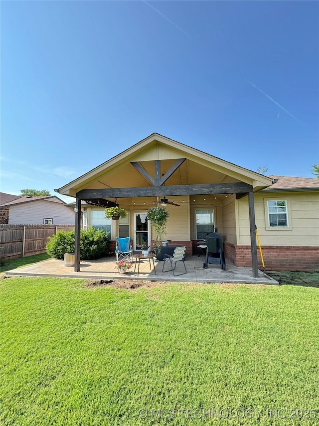 509 W Ryan St, Catoosa, OK 74015 - rear view of house with a ceiling fan, a patio area, and brick siding